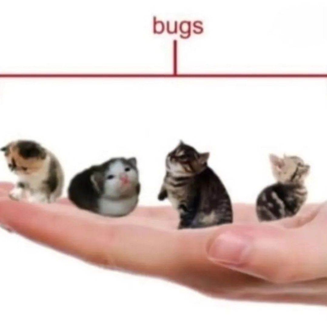 persons hand holding a bunch of tiny cats, they are labled as bugs